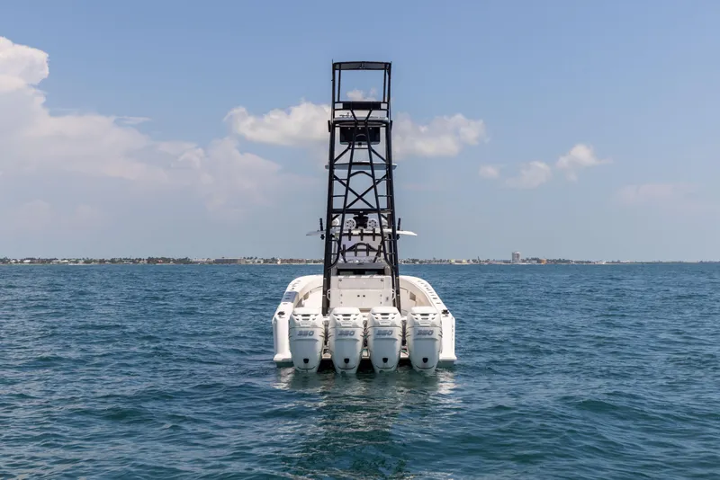 Slide: The Image of 2008 SeaVee 390 B boat with multiple engines on open water. - 4