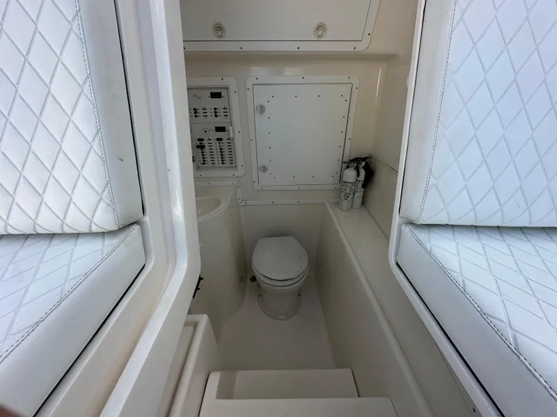Slide: The Image of 2008 SeaVee 390 B boat interior with toilet and control panel. - 40