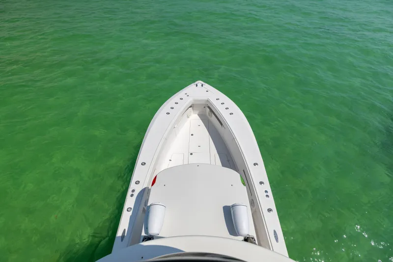 Slide: The Image of 2008 SeaVee 390 B boat on clear green water, aerial view. - 48