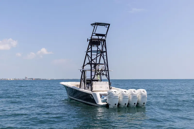 Slide: The Image of 2008 SeaVee 390 B boat with four engines on open water. - 5