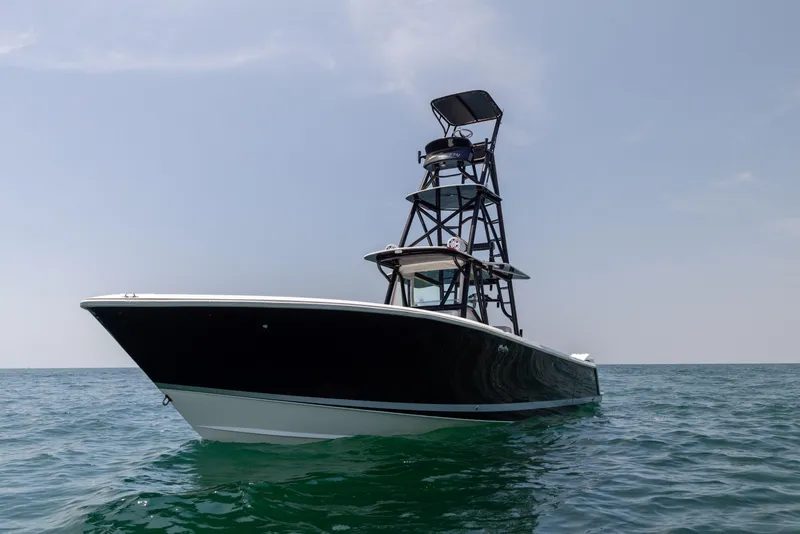 Slide: The Image of 2008 SeaVee 390 B boat on open water with a clear sky. - 7