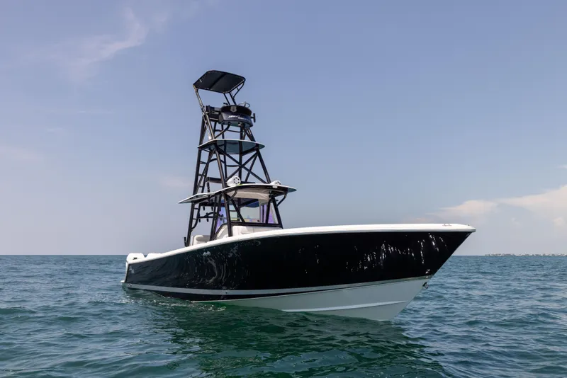 Slide: The Image of 2008 SeaVee 390 B boat on open water with a tall tower. - 8