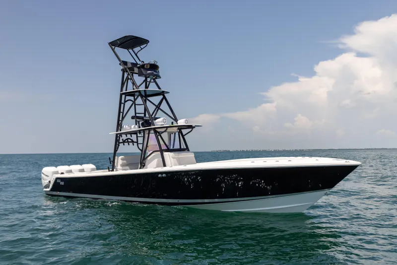 Slide: The Image of 2008 SeaVee 390 B boat on open water with clear sky. - 9