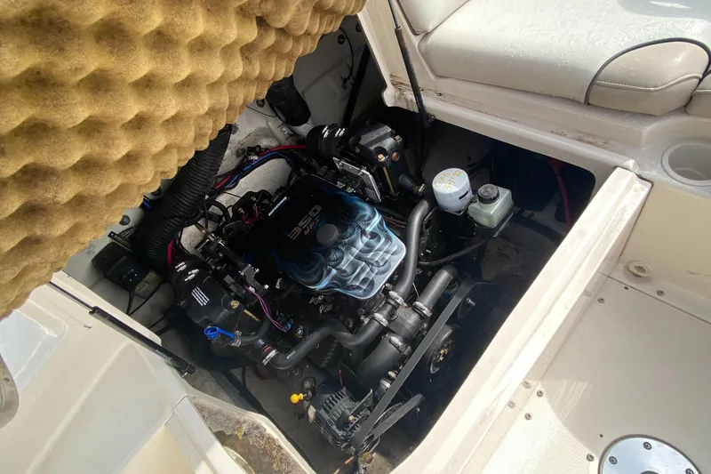 Slide: The Image of 2004 Sea Ray 240 Sundeck engine compartment, showcasing detailed mechanical components. - 17