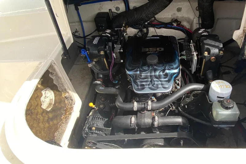 Slide: The Image of Engine compartment of a 2004 Sea Ray 240 Sundeck boat, featuring a 350 engine. - 18