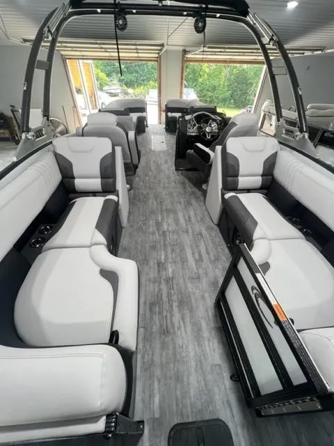 Slide: The Image of 2023 Crest Caribbean RS 250 SLC pontoon boat interior with modern seating and sleek design. - 5