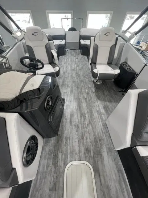Slide: The Image of 2023 Crest Caribbean RS 250 SLC boat interior with modern seating and sleek design. - 7