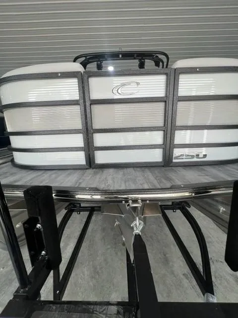 Slide: The Image of 2023 Crest Caribbean RS 250 SLC pontoon boat in showroom. - 9