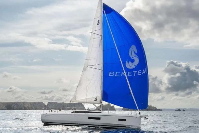 Slide: The Image of 2025 Beneteau Oceanis 37.1 sailing with blue spinnaker on open sea. - 9