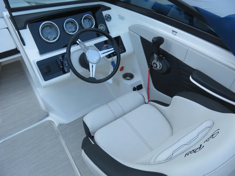 Slide: The Image of 2022 Sea Ray 19 SPX boat cockpit with steering wheel and control panel. - 4