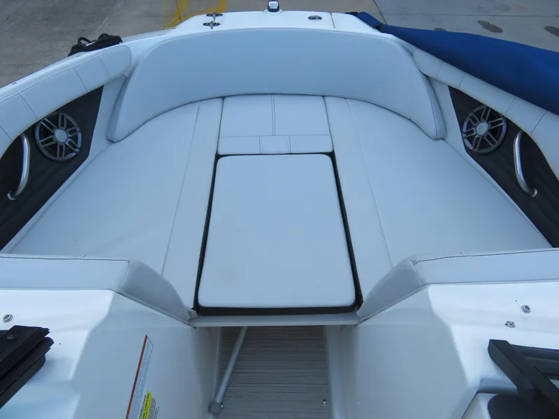 Slide: The Image of 2022 Sea Ray 19 SPX boat interior with white seating and speakers. - 5