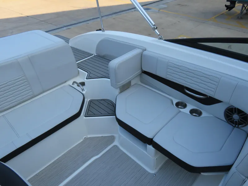 Slide: The Image of 2022 Sea Ray 19 SPX boat interior with white seating and cup holders. - 6