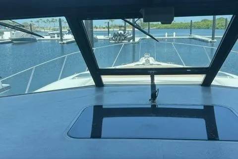 Slide: The Image of 1996 Tiara Yachts 40 Express boat view from cockpit, docked in marina. - 14