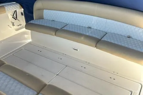 Slide: The Image of 1996 Tiara Yachts 40 Express interior seating with beige and white upholstery. - 6