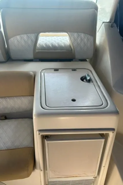 Slide: The Image of 1996 Tiara Yachts 40 Express interior seating and storage area. - 7