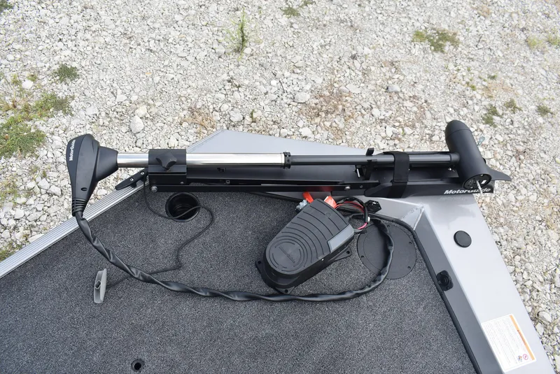 Slide: The Image of 2025 Lowe 16 Skorpion boat with trolling motor on gravel surface. - 12