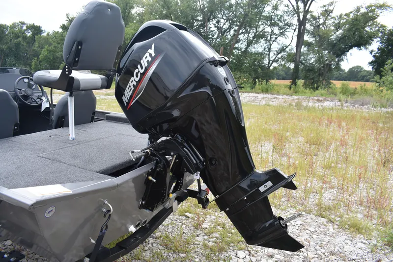 Slide: The Image of 2025 Lowe 16 Skorpion boat with Mercury outboard motor in grassy area. - 6