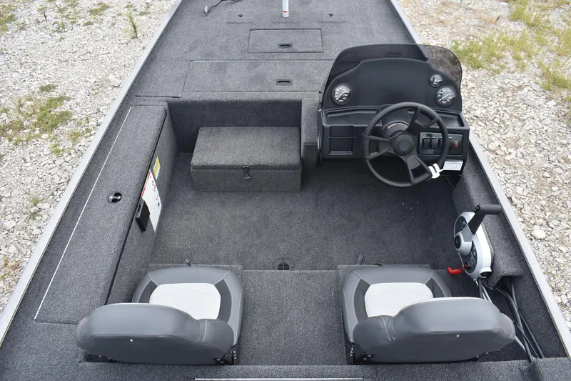 Slide: The Image of 2025 Lowe 16 Skorpion boat interior with dual seats and steering console. - 7