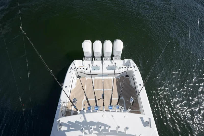 Slide: The Image of 2022 Yellowfin 54 Offshore boat with four engines, viewed from above on water. - 19