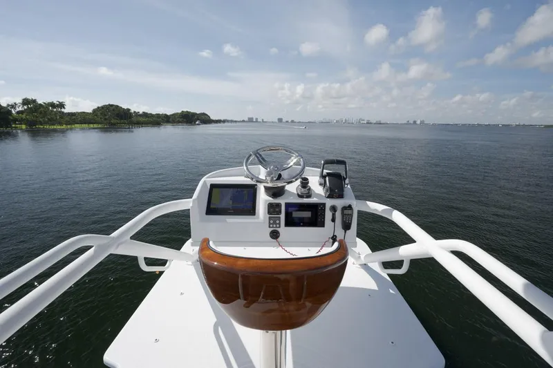 Slide: The Image of Helm of 2022 Yellowfin 54 Offshore boat with ocean view and clear sky. - 20