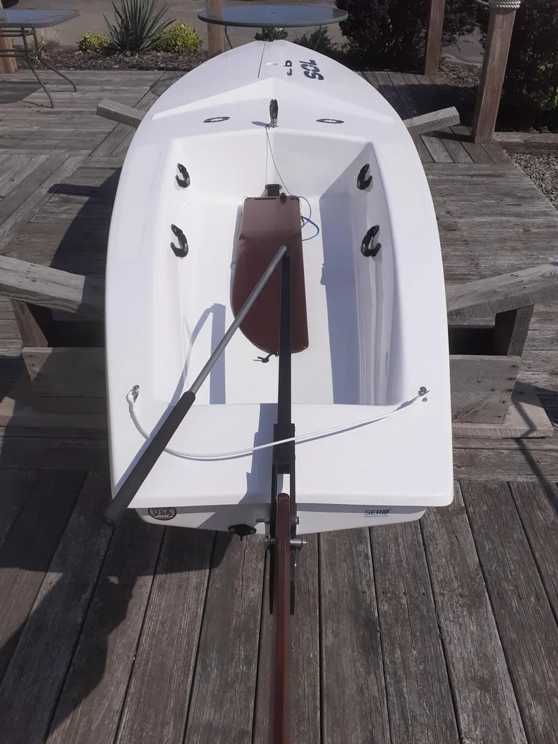 Slide: The Image of 2024 SERO Innovation SOL boat on wooden dock, top view. - 4