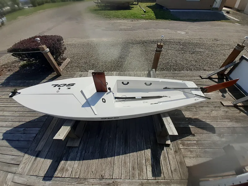 Slide: The Image of 2024 SERO Innovation SOL sailboat on wooden dock, top view. - 6