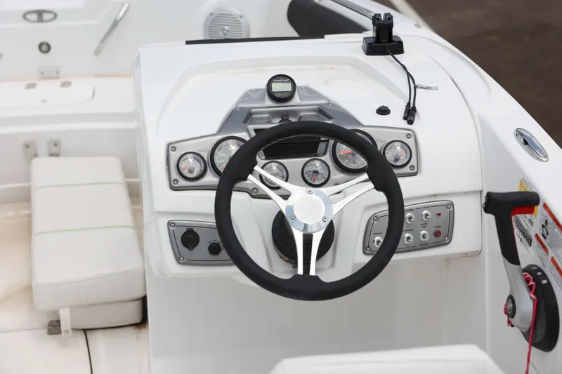 Slide: The Image of Modern 2022 Tahoe 1950 boat interior with sleek seating and steering console. - 4