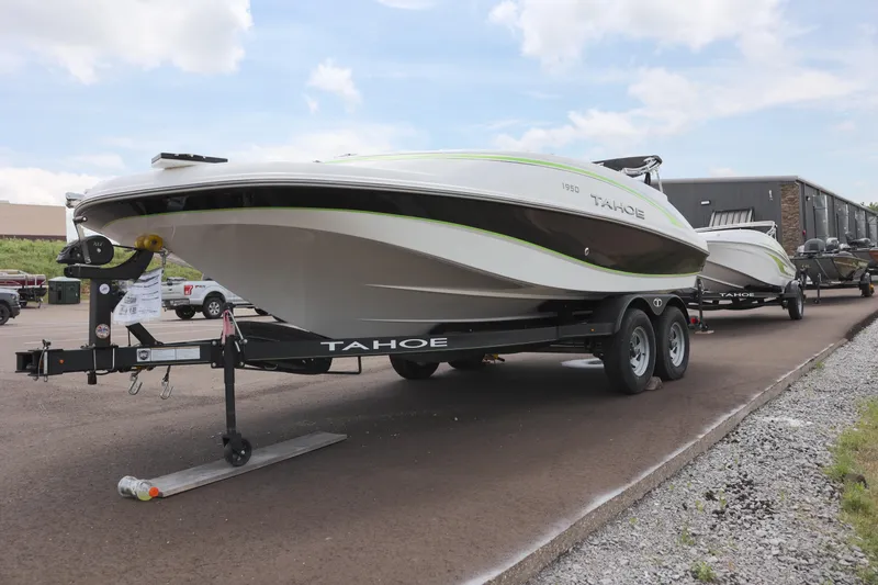 Slide: The Image of Steering console of a 2022 Tahoe 1950 boat with gauges and controls. - 5