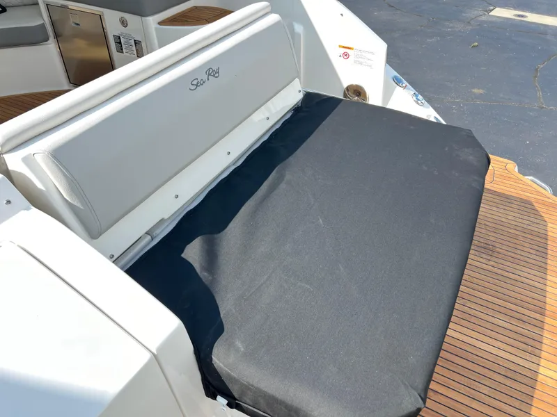 Slide: The Image of 2025 Sea Ray Sundancer 320 boat seating area with black cover. - 13