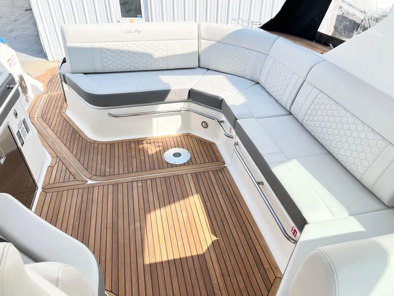 Slide: The Image of Luxurious 2025 Sea Ray Sundancer 320 yacht interior with elegant seating and teak flooring. - 7