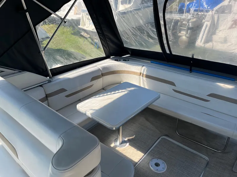 Slide: The Image of 1999 Formula 41 Performance Cruiser interior with seating and table under canopy. - 13