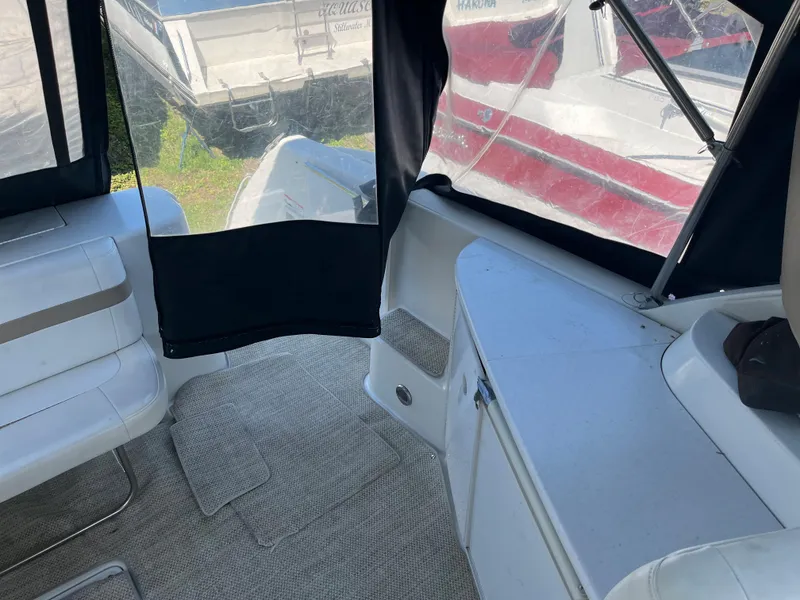 Slide: The Image of 1999 Formula 41 Performance Cruiser interior with seating and covered deck area. - 14