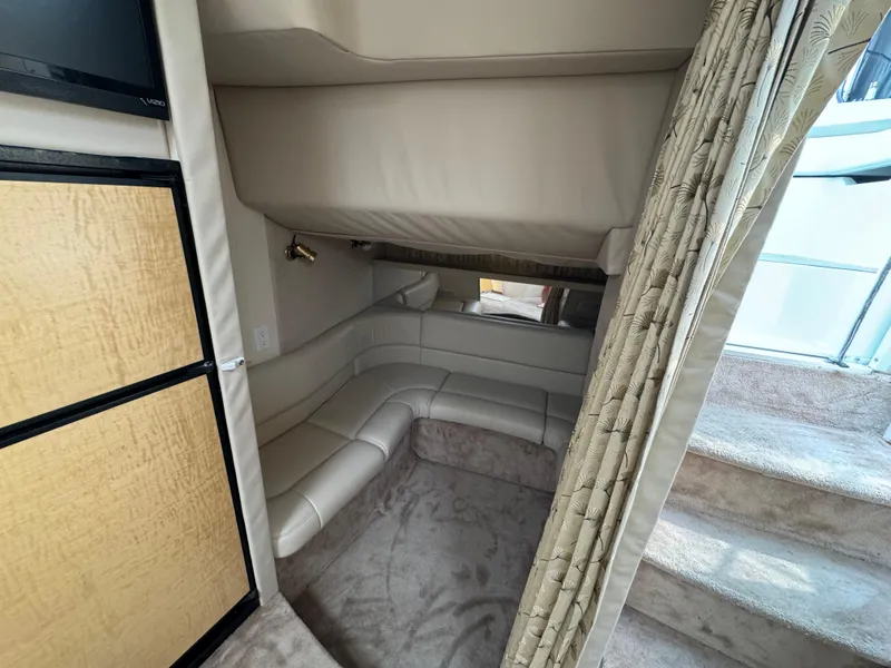 Slide: The Image of 1999 Formula 41 Performance Cruiser interior with beige seating and carpeted stairs. - 21