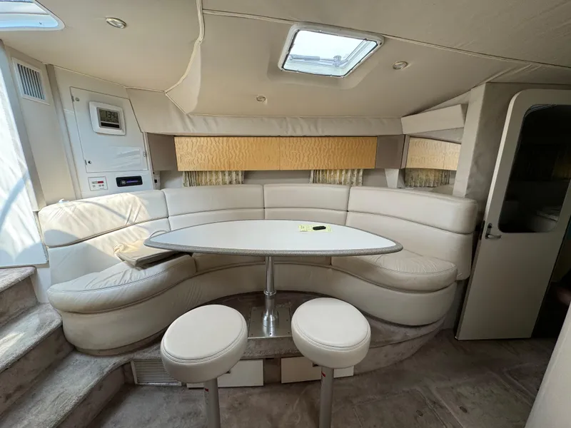 Slide: The Image of 1999 Formula 41 Performance Cruiser interior with curved seating and table. - 22