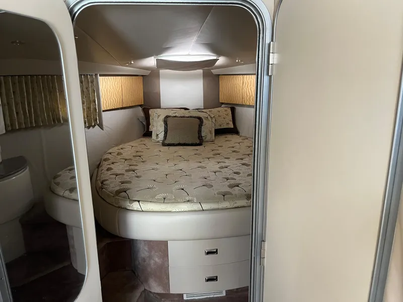 Slide: The Image of 1999 Formula 41 Performance Cruiser cabin with cozy bed and elegant decor. - 26