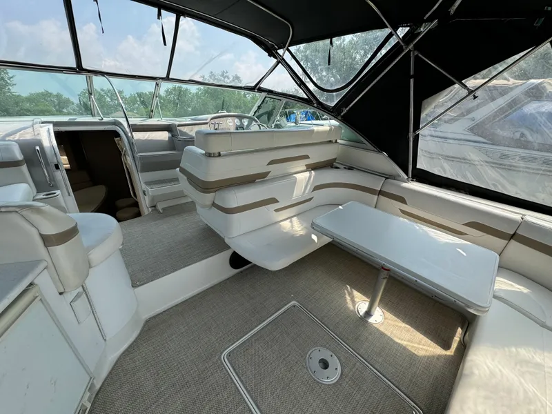 Slide: The Image of 1999 Formula 41 Performance Cruiser interior with seating and table under canopy. - 3