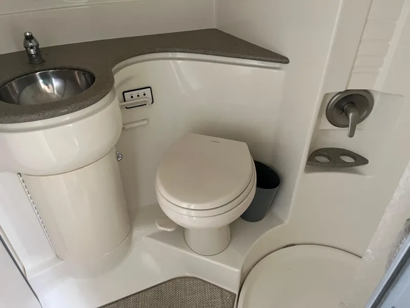 Slide: The Image of 1999 Formula 41 Performance Cruiser bathroom with sink, toilet, and shower. - 34