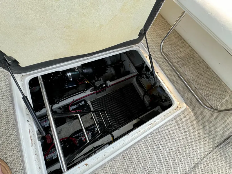 Slide: The Image of Engine compartment of a 1999 Formula 41 Performance Cruiser, showing mechanical components and wiring. - 39