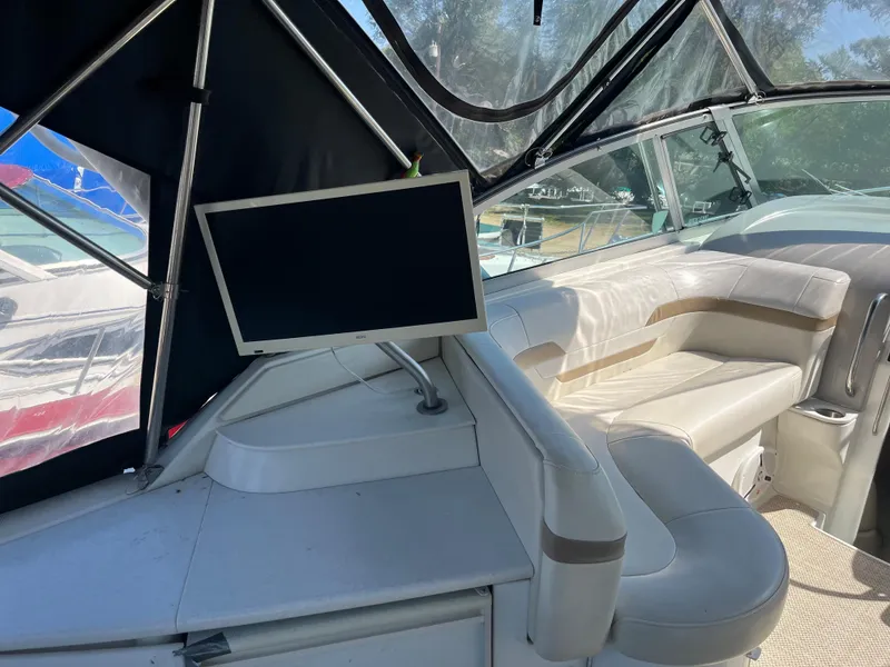 Slide: The Image of 1999 Formula 41 Performance Cruiser interior with seating and mounted screen. - 4