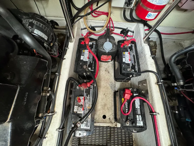 Slide: The Image of Battery compartment of a 1999 Formula 41 Performance Cruiser with four batteries and wiring. - 40