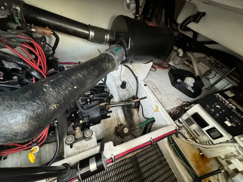 Slide: The Image of Engine compartment of a 1999 Formula 41 Performance Cruiser with visible components and wiring. - 43