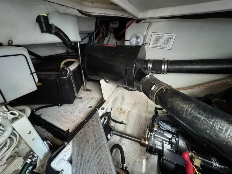 Slide: The Image of Engine compartment of a 1999 Formula 41 Performance Cruiser, showcasing mechanical components and wiring. - 46