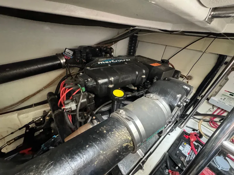 Slide: The Image of Engine compartment of a 1999 Formula 41 Performance Cruiser with visible MerCruiser components. - 47