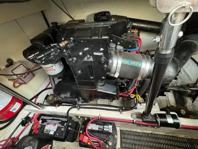 Slide: The Image of Engine compartment of a 1999 Formula 41 Performance Cruiser with visible components and wiring. - 48