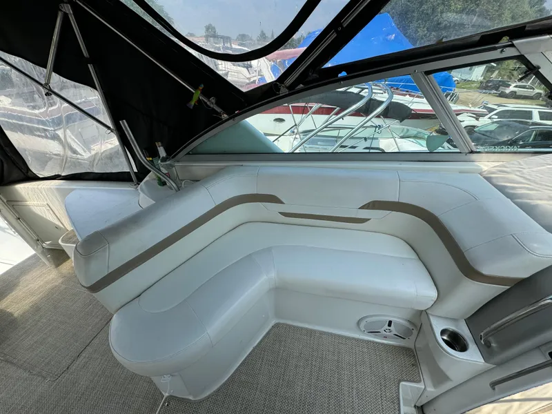 Slide: The Image of 1999 Formula 41 Performance Cruiser interior with white seating and carpeted floor. - 6
