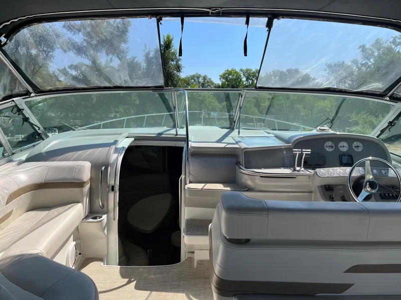 Slide: The Image of 1999 Formula 41 Performance Cruiser cockpit with modern controls and seating, surrounded by lush greenery. - 7