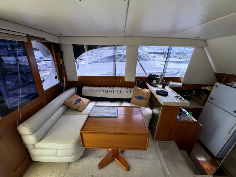 Slide: The Image of Interior of 1990 Post 44 Sport Fisherman yacht with seating and kitchenette. - 15