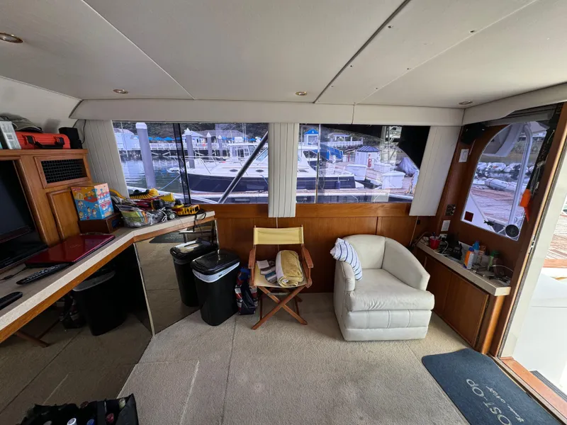 Slide: The Image of Interior of 1990 Post 44 Sport Fisherman yacht with seating and marina view. - 16