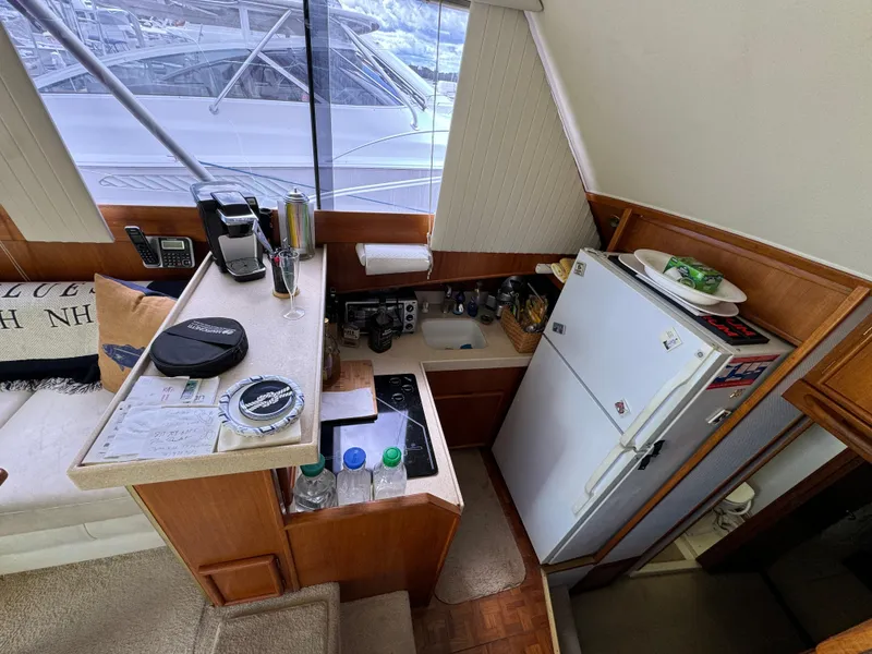 Slide: The Image of Interior of 1990 Post 44 Sport Fisherman yacht kitchen with appliances and seating area. - 19