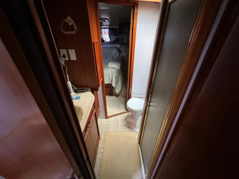 Slide: The Image of Interior of 1990 Post 44 Sport Fisherman yacht showing bathroom and bedroom. - 22